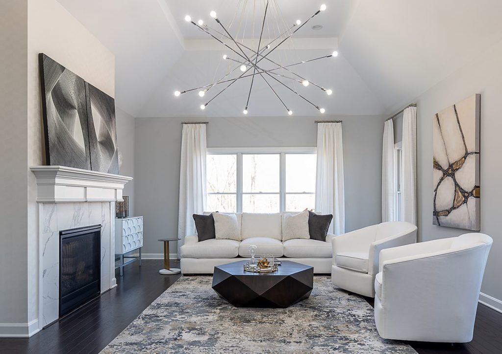 This contemporary room lightens up with the huge chandelier.